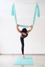 woman is doing aerial yoga